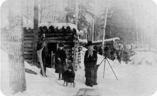 New Iceland pioneers posing in front of their log cabin in the Gimli area, no date.

Source: Archives of Manitoba